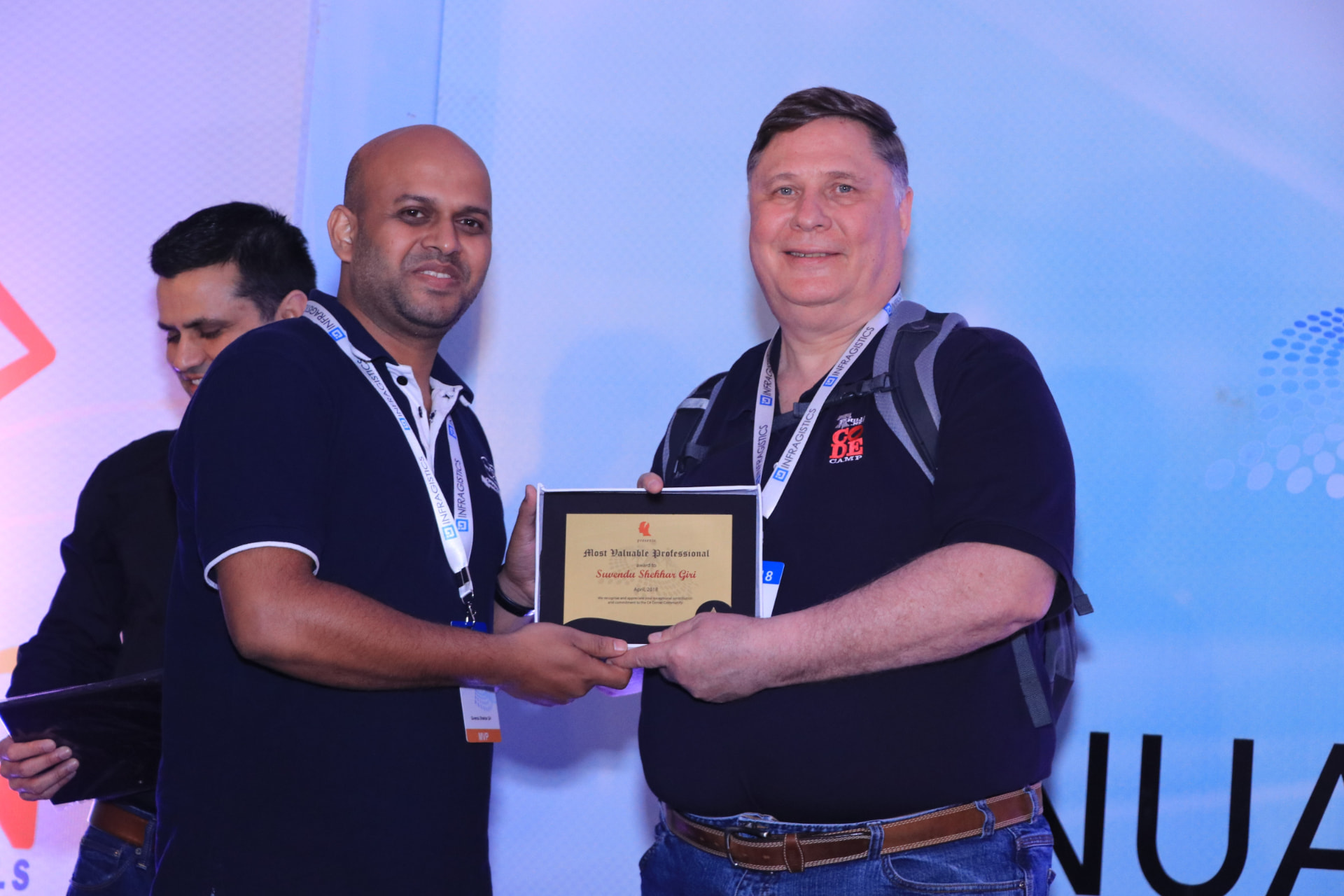 Suvendu Shekhar Giri receiving the C# Corner Most Valuable Professional award plaque on stage in 2018